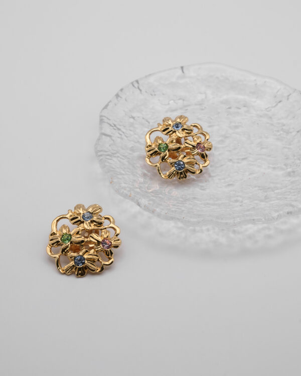 Klipsy Yves Saint Laurent – złote kwiaty z kryształami