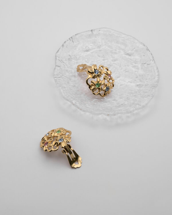 Klipsy Yves Saint Laurent – złote kwiaty z kryształami