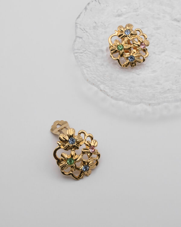 Klipsy Yves Saint Laurent – złote kwiaty z kryształami