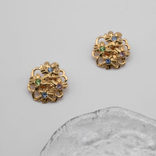 Klipsy Yves Saint Laurent – złote kwiaty z kryształami