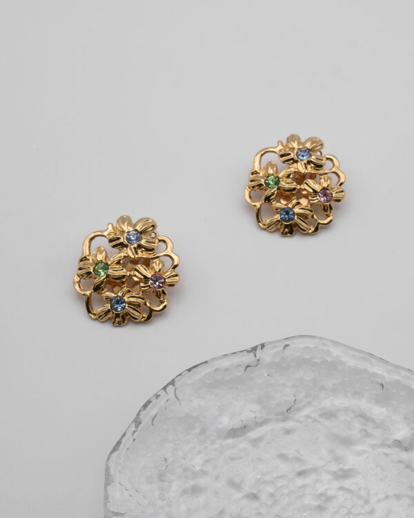 Klipsy Yves Saint Laurent – złote kwiaty z kryształami