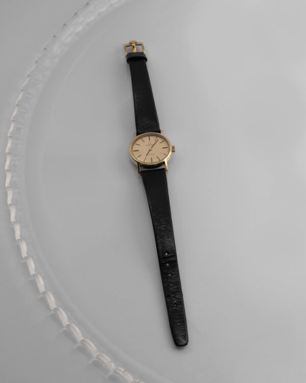 Omega Genève – klasyczny zegarek szwajcarski w złotej tonacji, lata 60./70.
