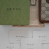 Portfel Gucci GG Supreme z kultowym monogramem
