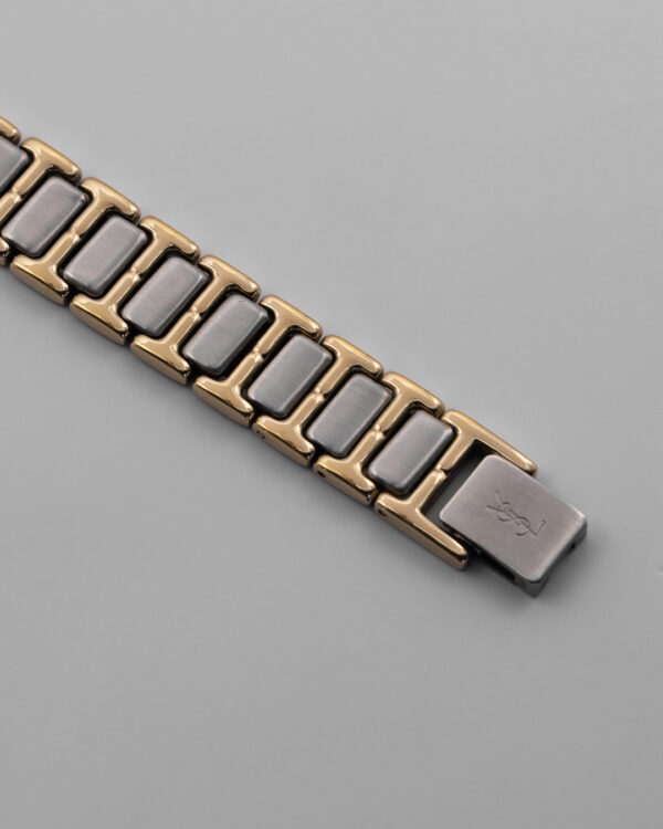 Zegarek Yves Saint Laurent Arty bicolor – złota koperta z czarną tarczą, Swiss Made, lata 90.