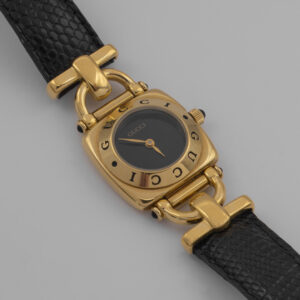 Zegarek Gucci Horsebit Swiss Made - pozłacany zegarek z czarną tarczą i skórzanym paskiem, lata 80./90.