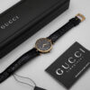 Zegarek Gucci 3000 Series - elegancka złota koperta z czarną tarczą na skórzanym pasku, lata 80./90.
