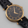 Zegarek Gucci 3000 Series - elegancka złota koperta z czarną tarczą na skórzanym pasku, lata 80./90.