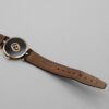 Zegarek Gucci 3000 Series - elegancka złota koperta z czarną tarczą na skórzanym pasku, lata 80./90.