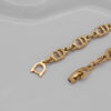Bransoletka Christian Dior - ogniwa z monogramów w złotej odsłonie, lata 90./2000.