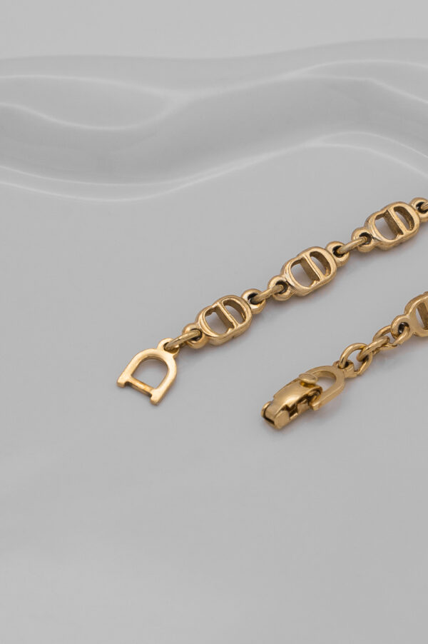 Bransoletka Christian Dior - ogniwa z monogramów w złotej odsłonie, lata 90./2000.