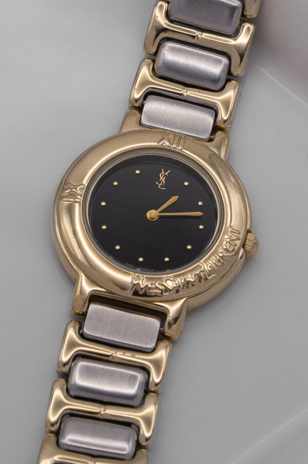 Zegarek Yves Saint Laurent - z charakterną czarną tarczą na rzeźbiarskiej bransolecie, lata 90.